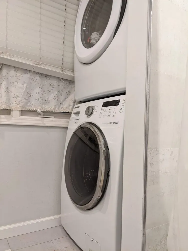 Stackable washer and dryer column in a laundry closet — Spark Appliance Repair, Mountain View CA