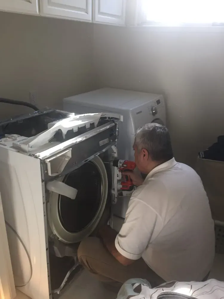 Eli Musayev repairing a Samsung front-load washer — Spark Appliance Repair, Mountain View CA